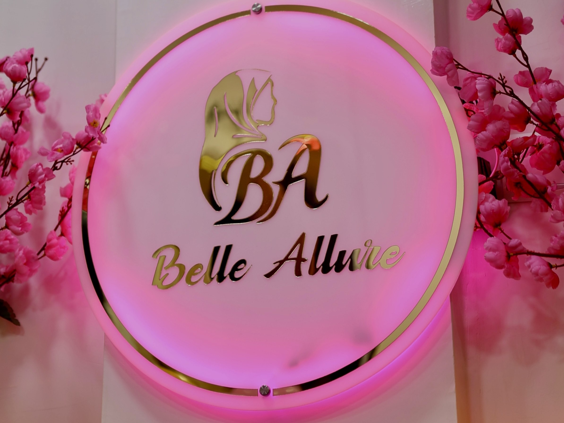 Belle Allure brand sign surrounded by soft pink details